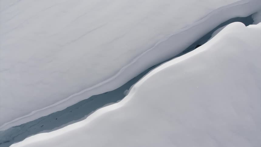 A big crevice is in the ice below