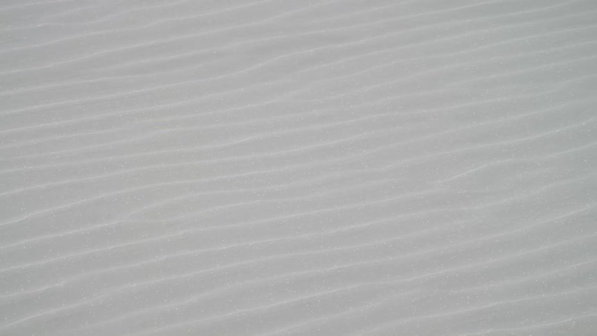 A natural surface with ridges extends outward