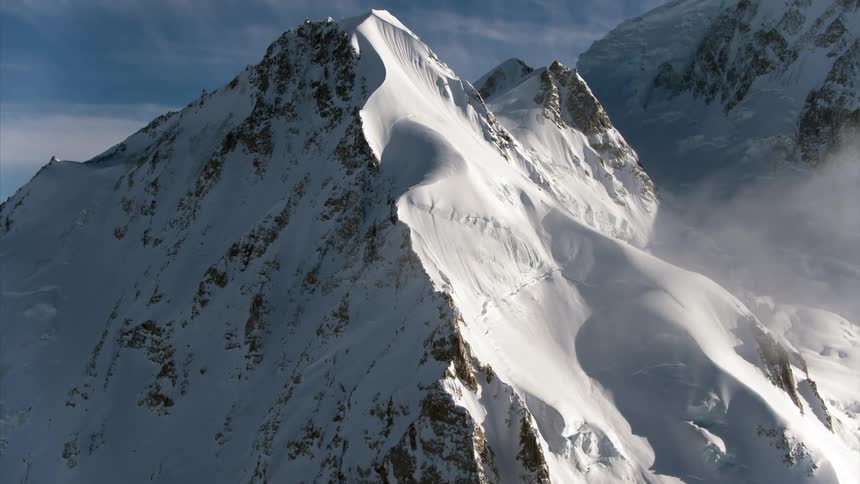 A mountain covered in snow is displayed