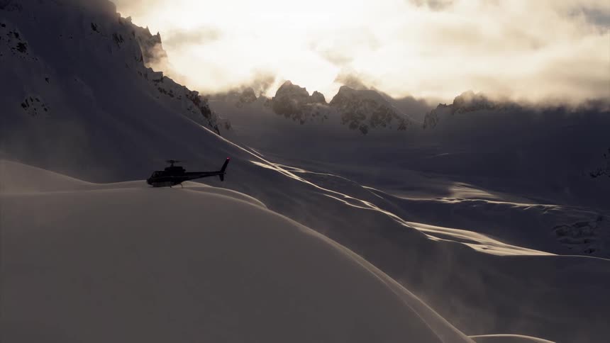 Helicopter on snow bank in vast mountain range