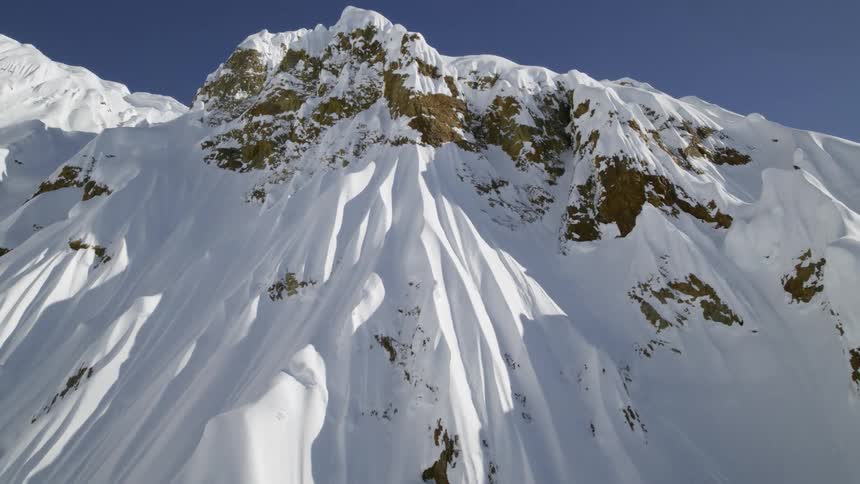 The top of a snow covered mountain
