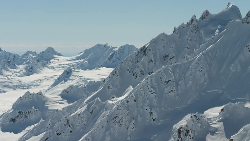 A mountain range covered in deep snow