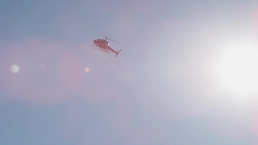 A helicopter is flying in the sky