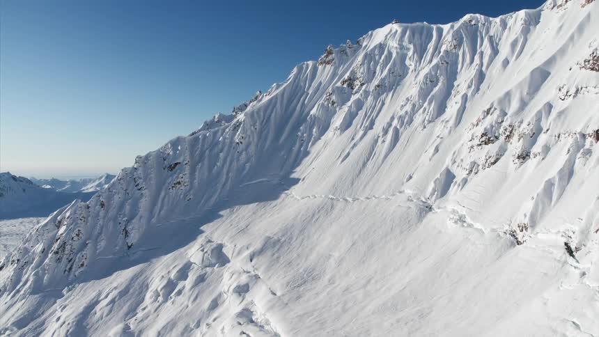 Tall rugged mountains covered in snow