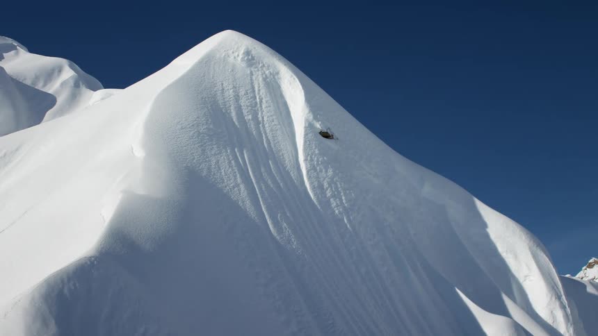 Snow covering mountains is displayed