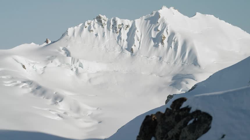 Snow covers a mountain range