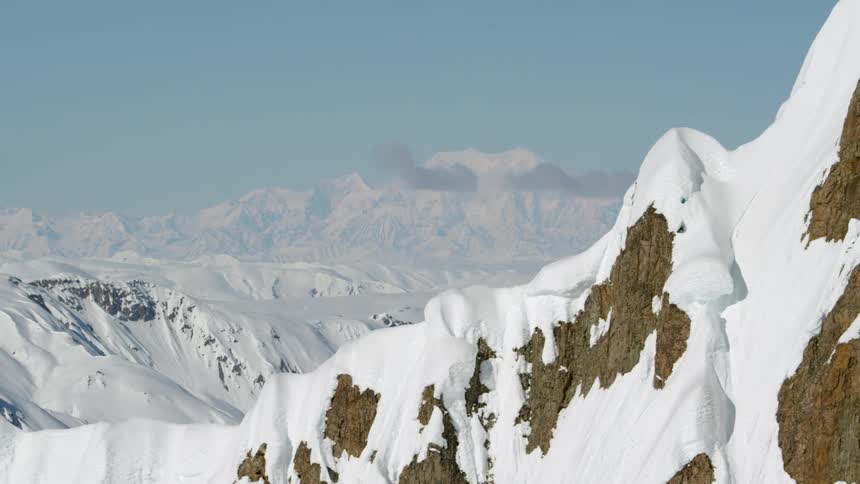 The tall mountains are covered with snow and ice