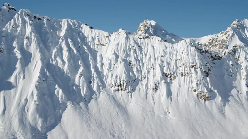 A mountain range covered in winter snow