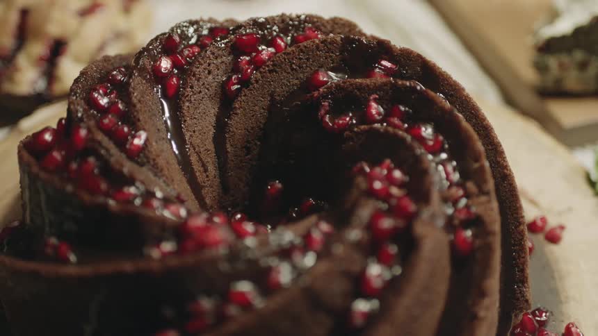 A chocolate cake with bits of fruit