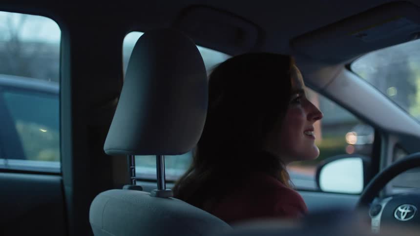 A woman sitting in a car
