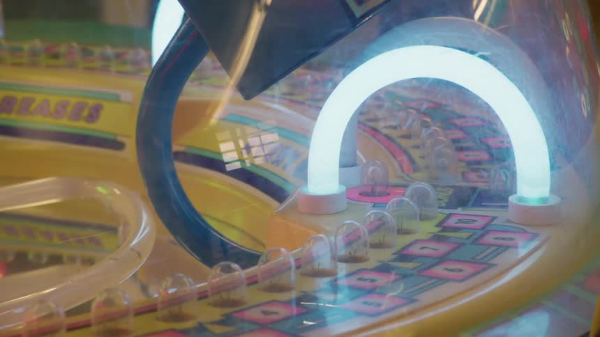 The lights flash on the arcade machine
