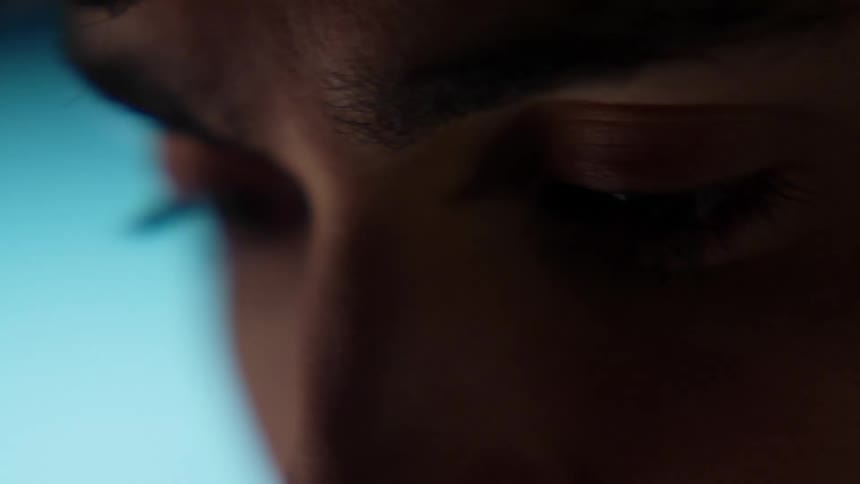 A close up of a mans face is displayed