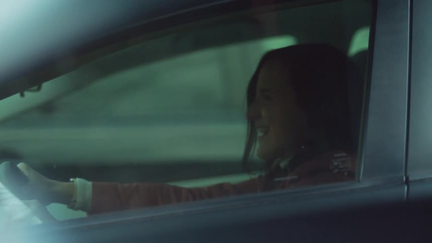 The woman cries in her car