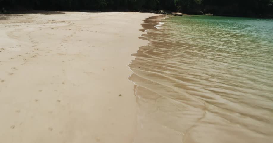 Aerial view along shoreline of island beach