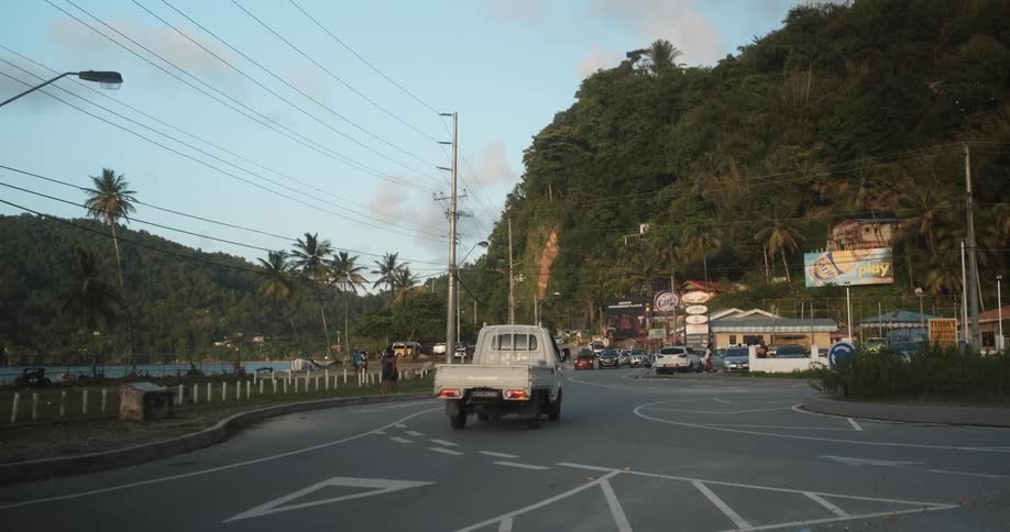 A truck drives through an intersection of a small town