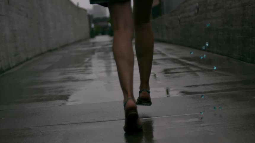 A woman is running in the alley and dropping jewels