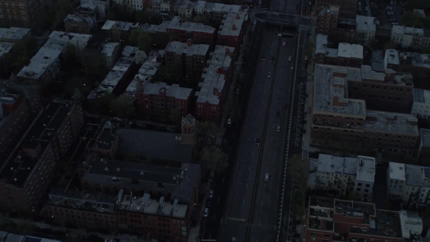 Cars are driving through a city