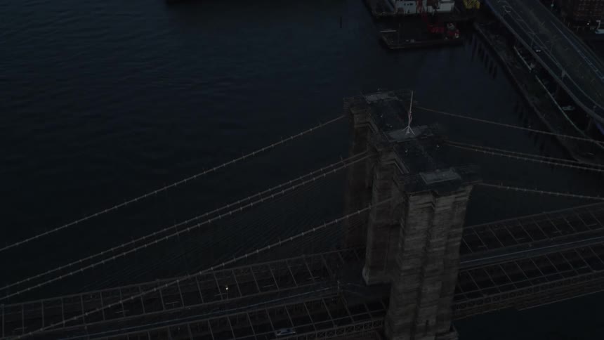 Aerial view of suspension bridge over river at night