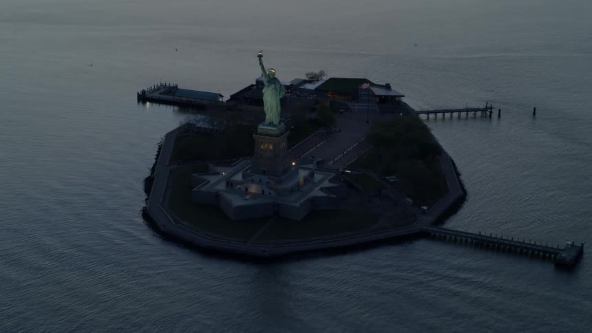 The statue of liberty and the water surrounding it