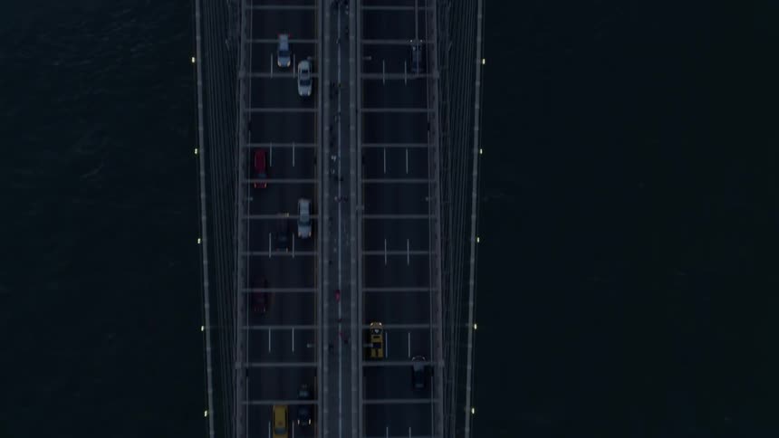 Vehicles travel over the long bridge