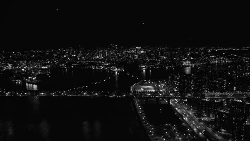 Black and white footage of city at night