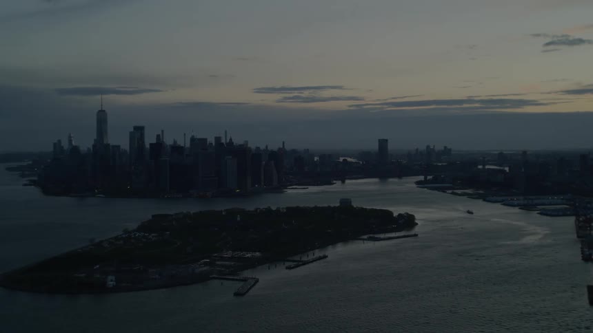 City silhouetted against sky at dusk