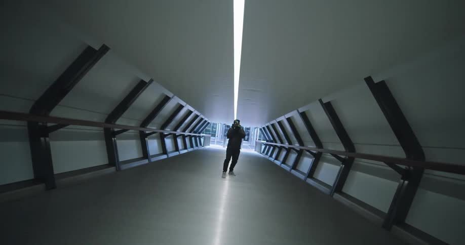 A man in a tunnel takes photos