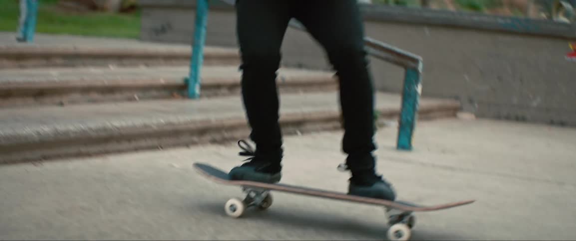 A man is skateboarding down some stairs