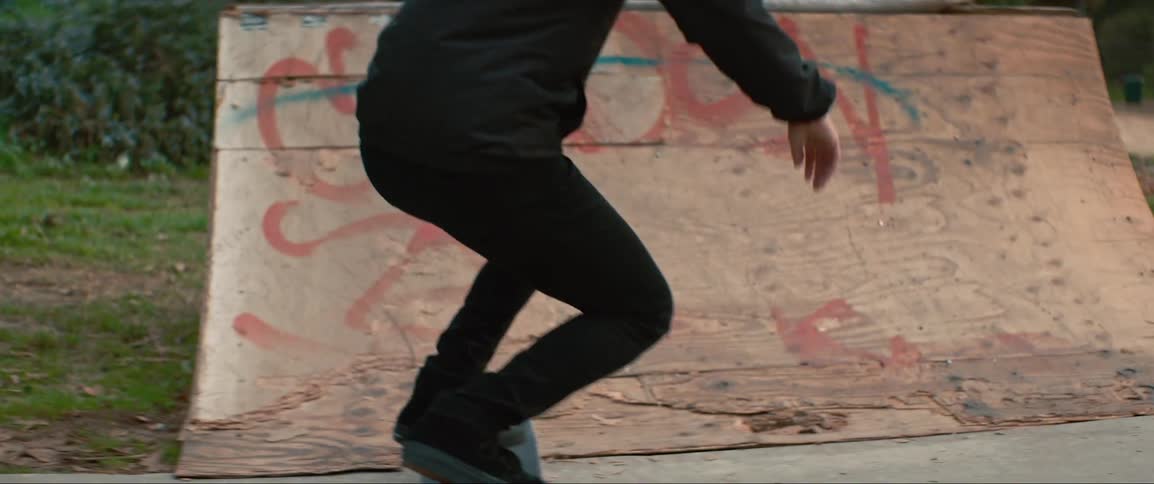 A man is skateboarding outdoors