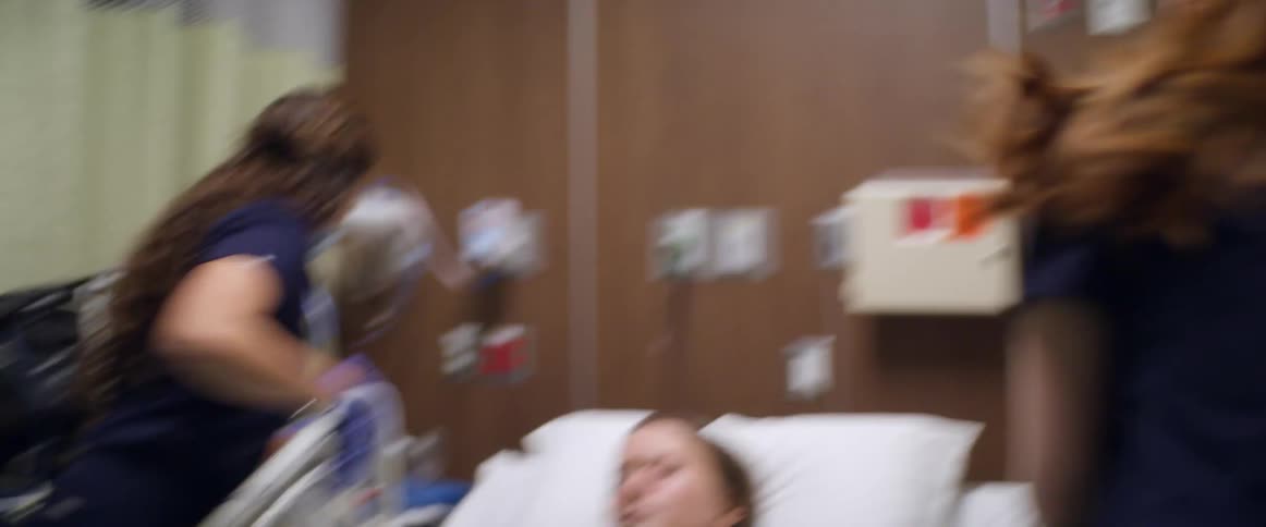 The hospital staff helps a woman