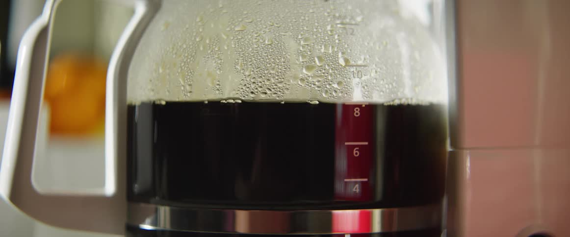 Coffee is brewing in the machine