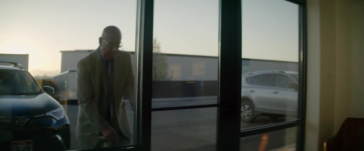 Man opens the door of of the store