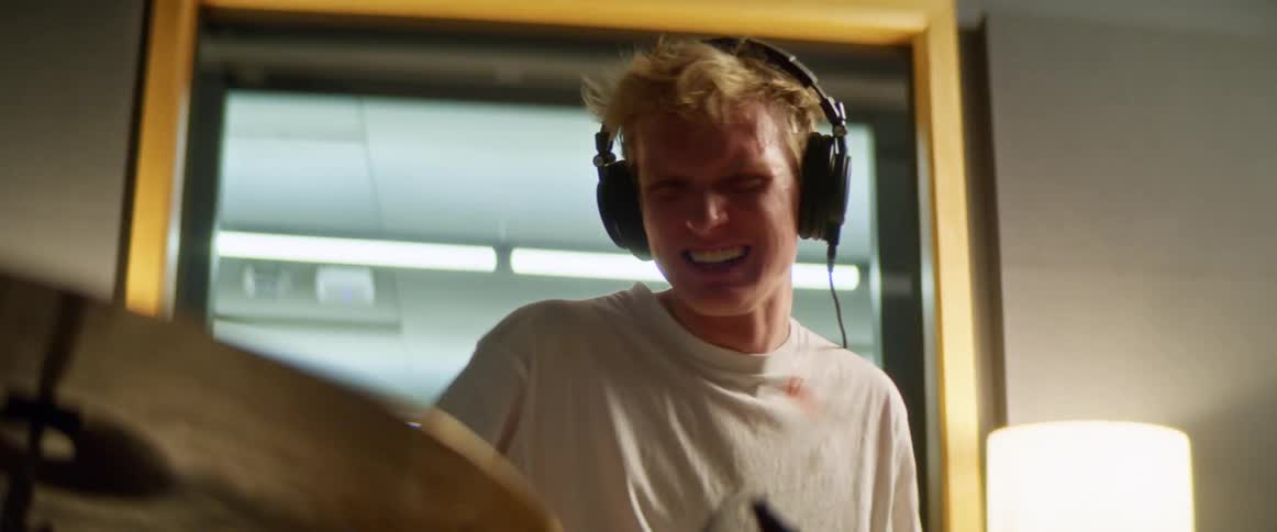 Male drummer plays drums fast