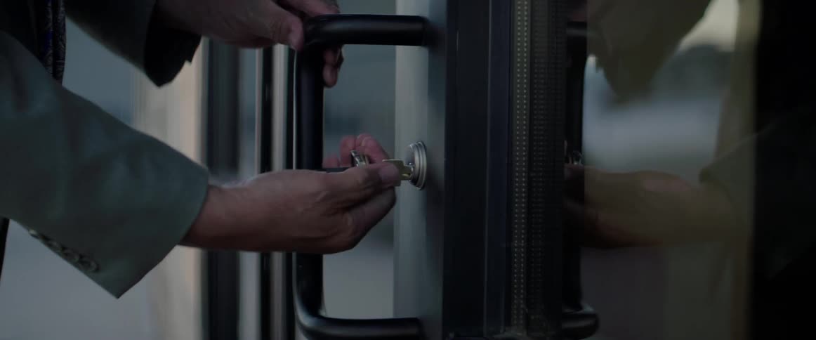 Man opens the door of a store