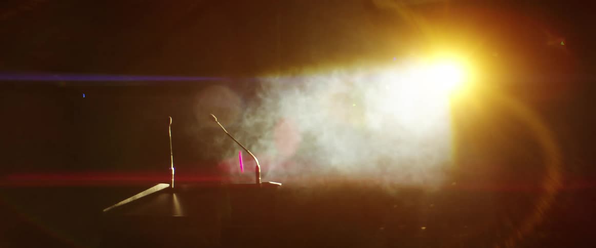Smoke rolls over the empty stage