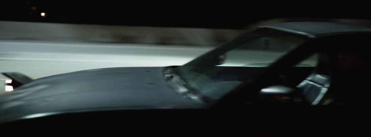 Vehicles driving in a road at night