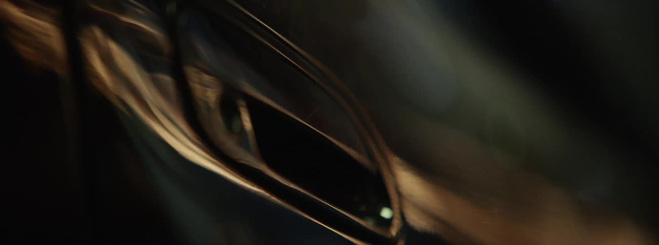 Lights reflected off of the door of a moving car