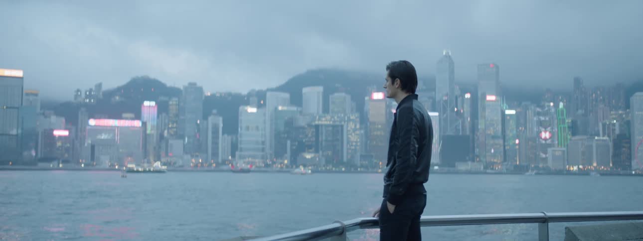 A man looks out over to the city