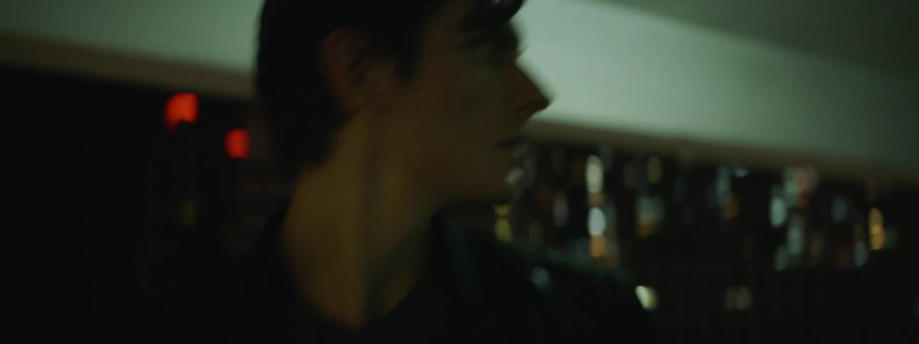 Man walks through parking garage at night