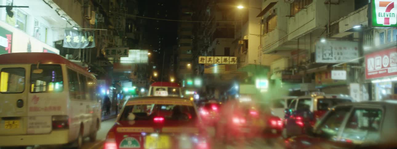 People and cars in a busy city street