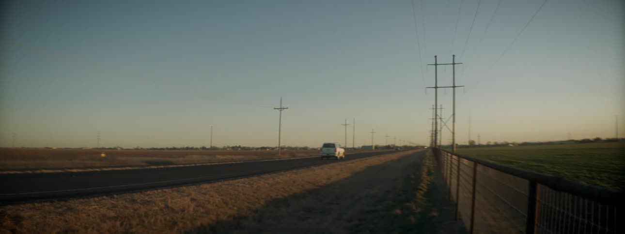 A vehicle races down the highway