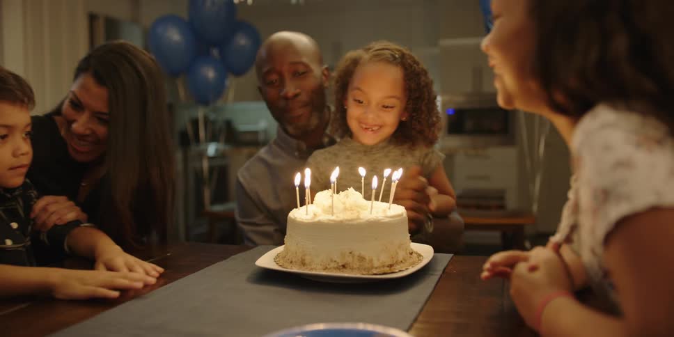 A family is celebrating their childs birthday