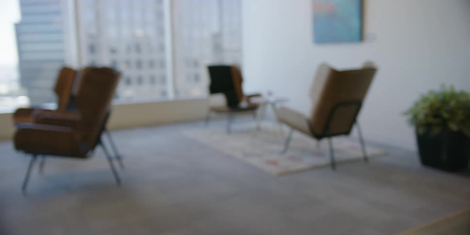 Black man walks and puts the books in the bag in the office