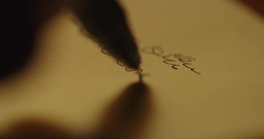 A person writes a letter