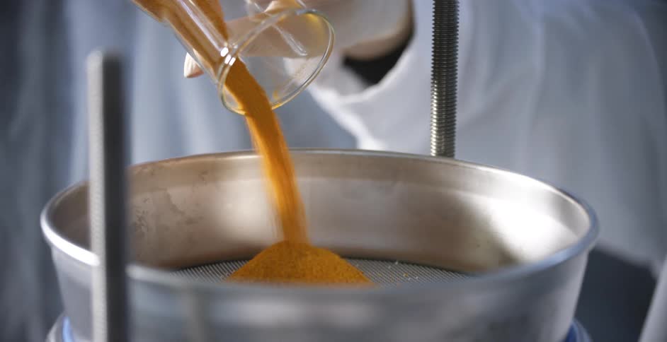 A person is in a lab using scientific machinery