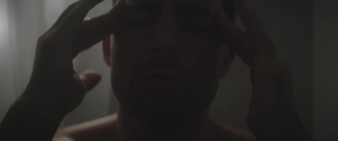A man massaging his own temples