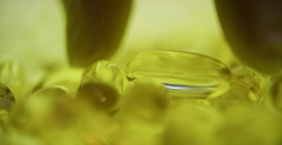 Man picks up a yellow pill