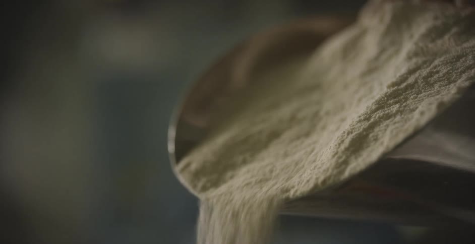 Sand falling out of a shovel