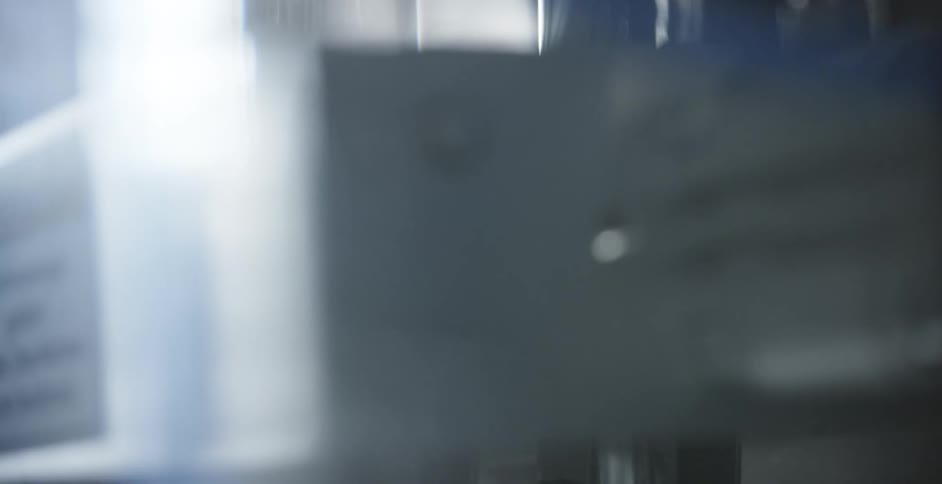 A piece of machinery drops and then goes back up