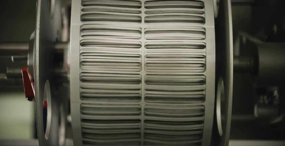 A mechanical reel winds something